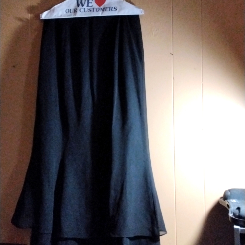 A black Adriann Papell skirt